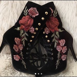 Black suede booties with embroidered roses